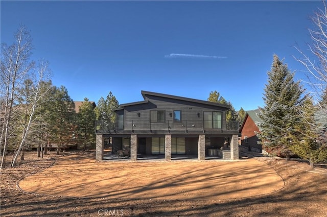 back of property featuring a patio area