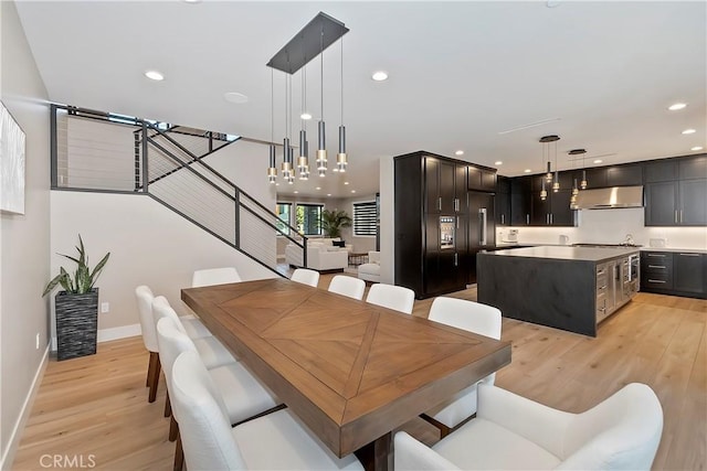 dining space with light hardwood / wood-style floors