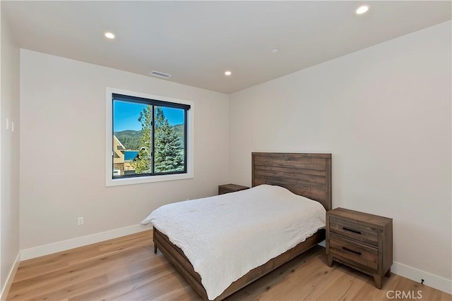 bedroom with light hardwood / wood-style flooring