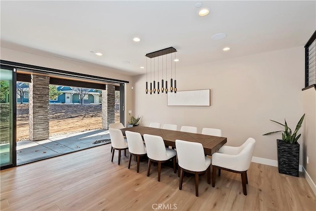 dining space featuring light hardwood / wood-style flooring