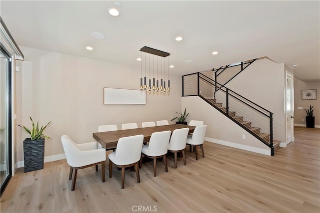 dining space with light wood-type flooring