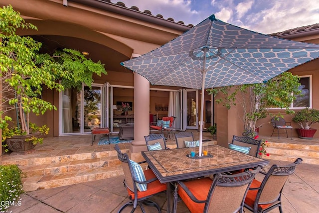 view of patio terrace at dusk