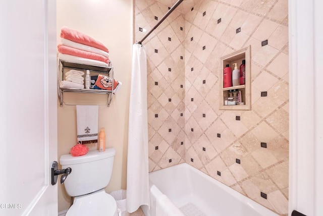 bathroom with toilet and shower / bath combo