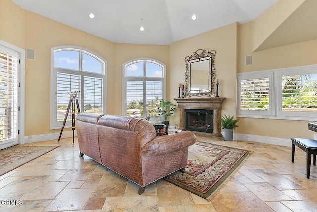 living room with high vaulted ceiling