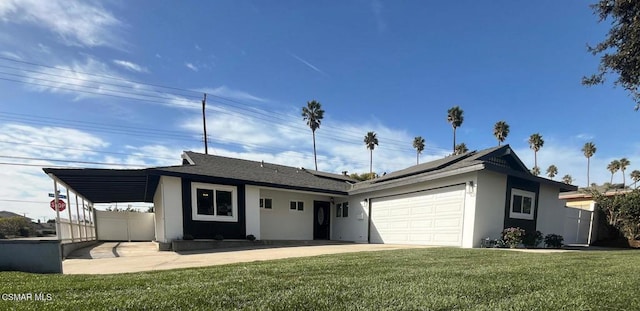 ranch-style house featuring a front yard, a carport, and a garage