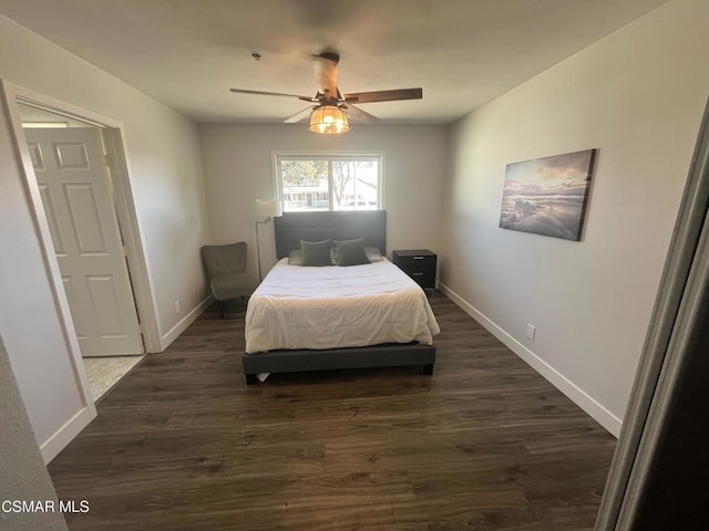 bedroom with ceiling fan and dark hardwood / wood-style floors