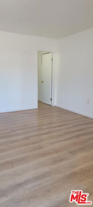 spare room featuring light hardwood / wood-style floors