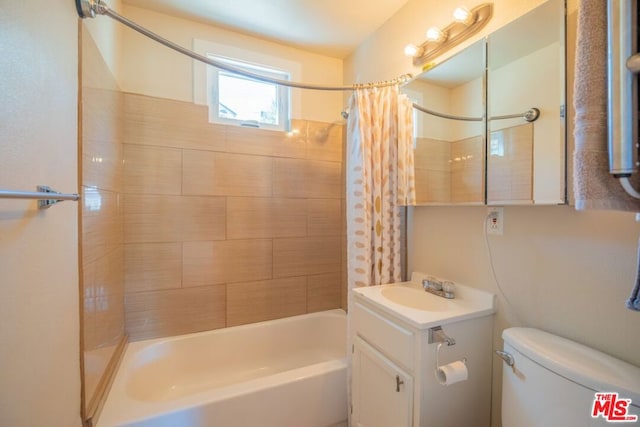 full bathroom featuring vanity, shower / bath combination with curtain, and toilet