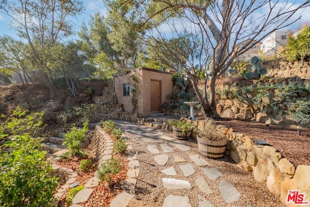 view of patio / terrace featuring a shed