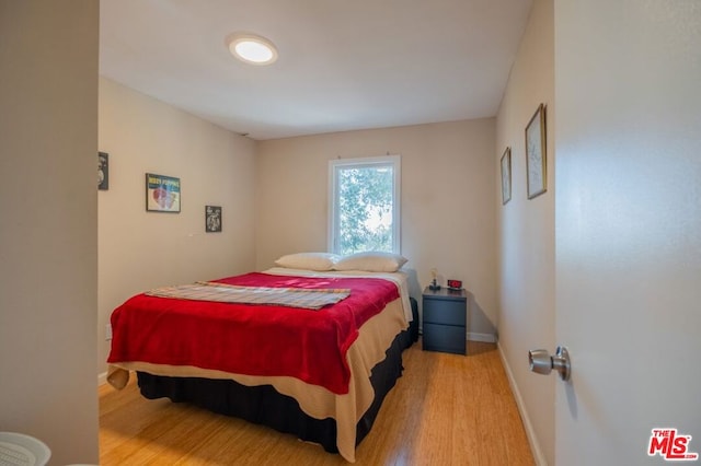 bedroom with light wood-type flooring