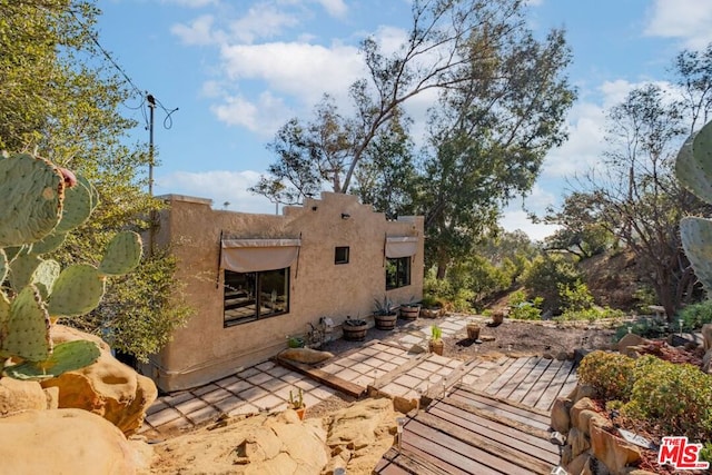 view of home's exterior with a patio area