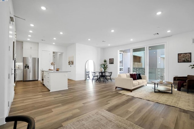 living room with light hardwood / wood-style floors