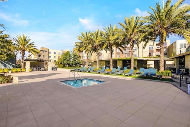 view of swimming pool with a community hot tub and a patio