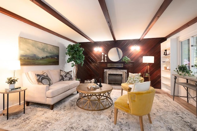 living room featuring wood-type flooring, lofted ceiling with beams, and wood walls