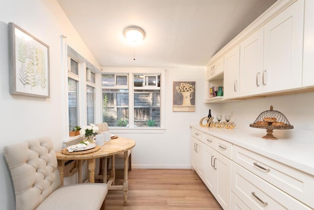 kitchen with white cabinets and light hardwood / wood-style floors