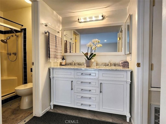 bathroom featuring tile patterned floors, walk in shower, and vanity