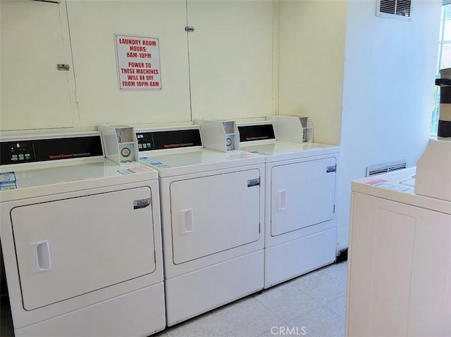 washroom featuring washer and dryer