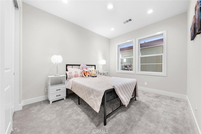 bedroom featuring recessed lighting, light carpet, visible vents, and baseboards