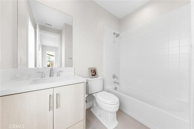 full bathroom featuring toilet, visible vents, shower / washtub combination, and vanity