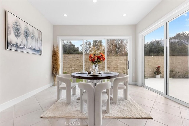 dining room featuring recessed lighting, baseboards, and light tile patterned floors