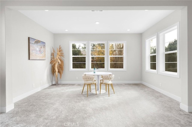 unfurnished sunroom featuring visible vents and a wealth of natural light