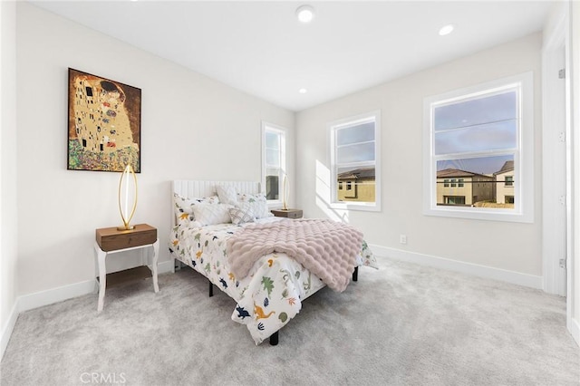 carpeted bedroom with recessed lighting and baseboards