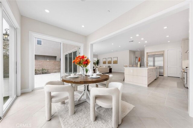 tiled dining room with plenty of natural light