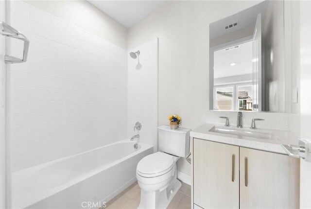 full bathroom featuring toilet, bathing tub / shower combination, tile patterned flooring, and vanity