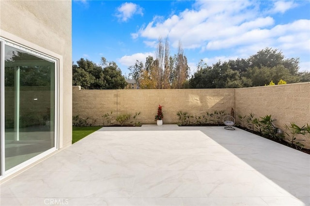 view of patio with a fenced backyard