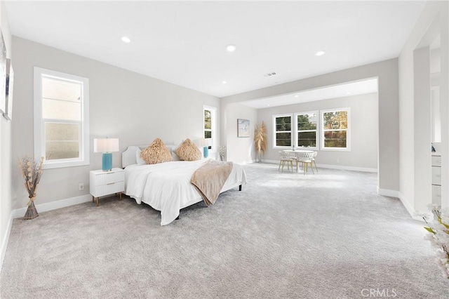 bedroom featuring recessed lighting, carpet, visible vents, and baseboards