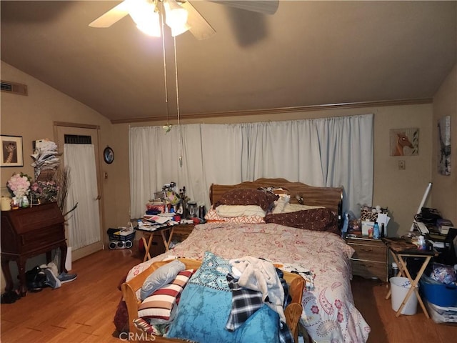 bedroom featuring ceiling fan, lofted ceiling, and light hardwood / wood-style floors