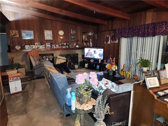 carpeted living room with wood ceiling, beam ceiling, and wood walls