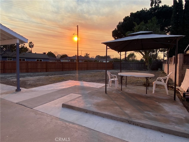 view of patio terrace at dusk