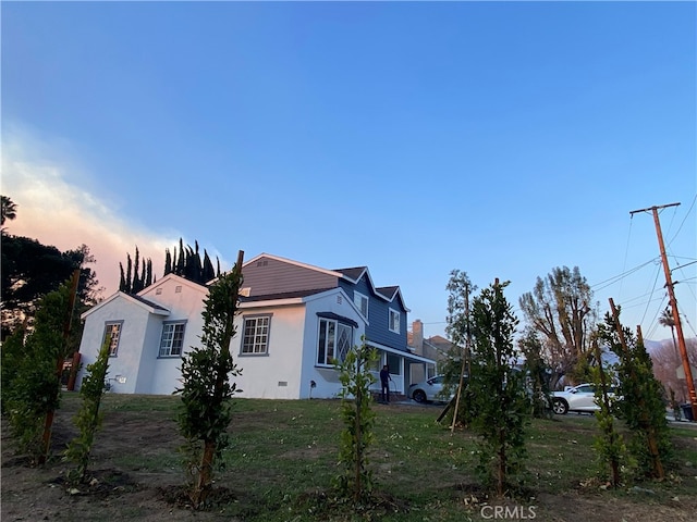 view of property exterior at dusk