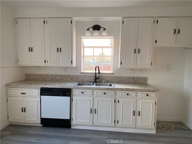 kitchen with dark wood-type flooring, sink, white cabinets, and dishwasher