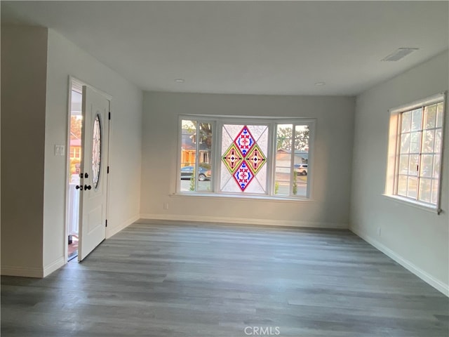 spare room with dark hardwood / wood-style floors