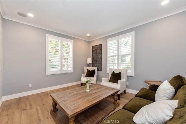 living room with light wood-type flooring and ornamental molding