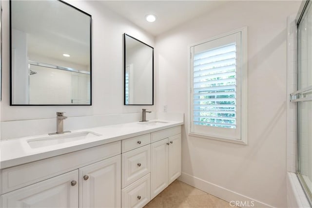 bathroom with tile patterned floors and vanity