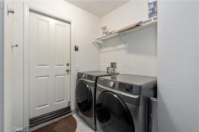 laundry room with independent washer and dryer