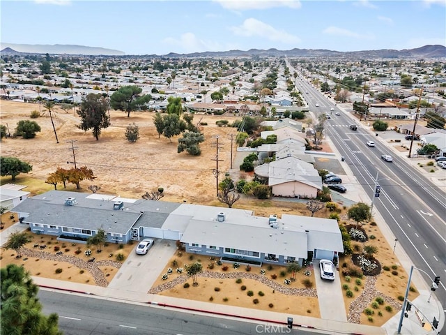 birds eye view of property with a mountain view