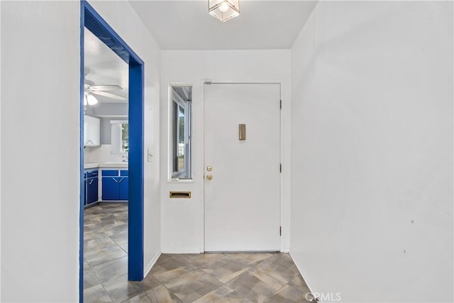 interior space featuring ceiling fan