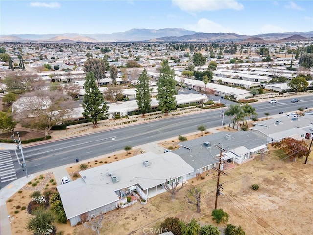 birds eye view of property featuring a mountain view