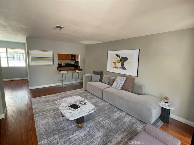 living room with dark hardwood / wood-style floors