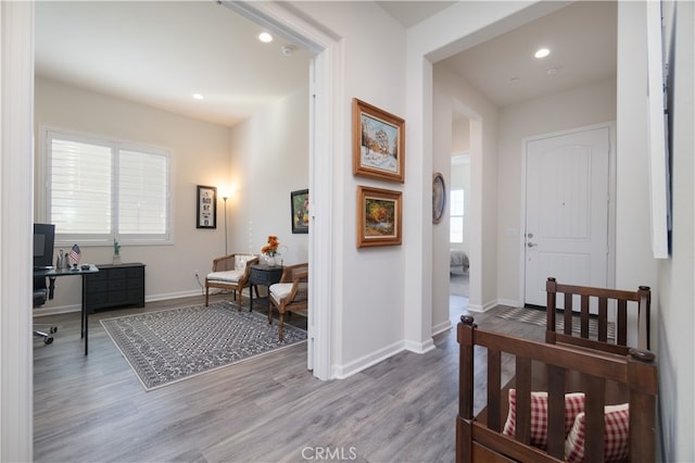 11121 Fourleaf Ct, Corona, CA 92883 - hallway featuring wood finished floors, a desk, and recessed lighting