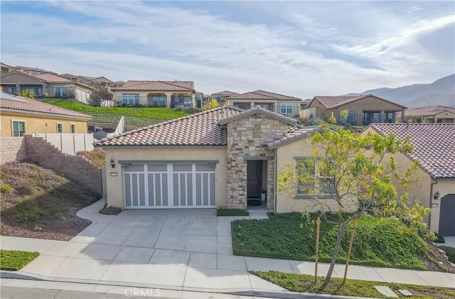 mediterranean / spanish house featuring a garage