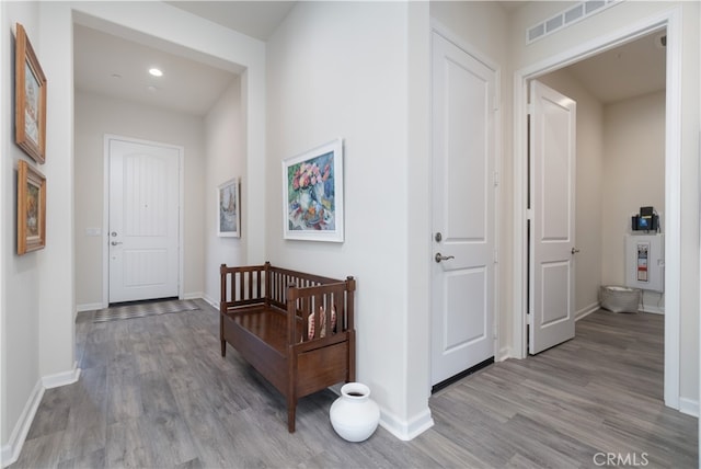 11121 Fourleaf Ct, Corona, CA 92883 - hall featuring light wood finished floors and recessed lighting