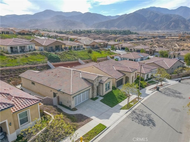 birds eye view of property featuring a mountain view