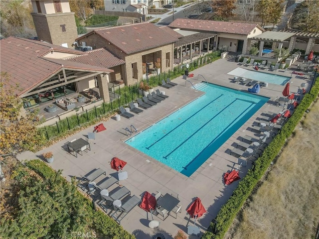 view of swimming pool with a pergola and a patio