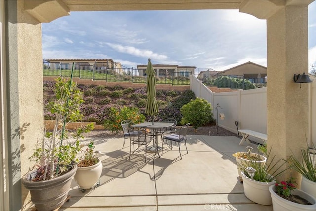 11121 Fourleaf Ct, Corona, CA 92883 - fenced backyard with outdoor dining area and a patio