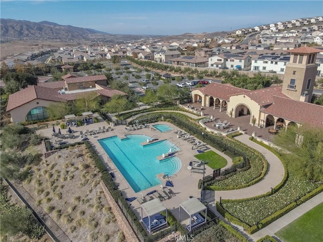 11121 Fourleaf Ct, Corona, CA 92883 - aerial view of property and surrounding area featuring nearby suburban area and a pool area